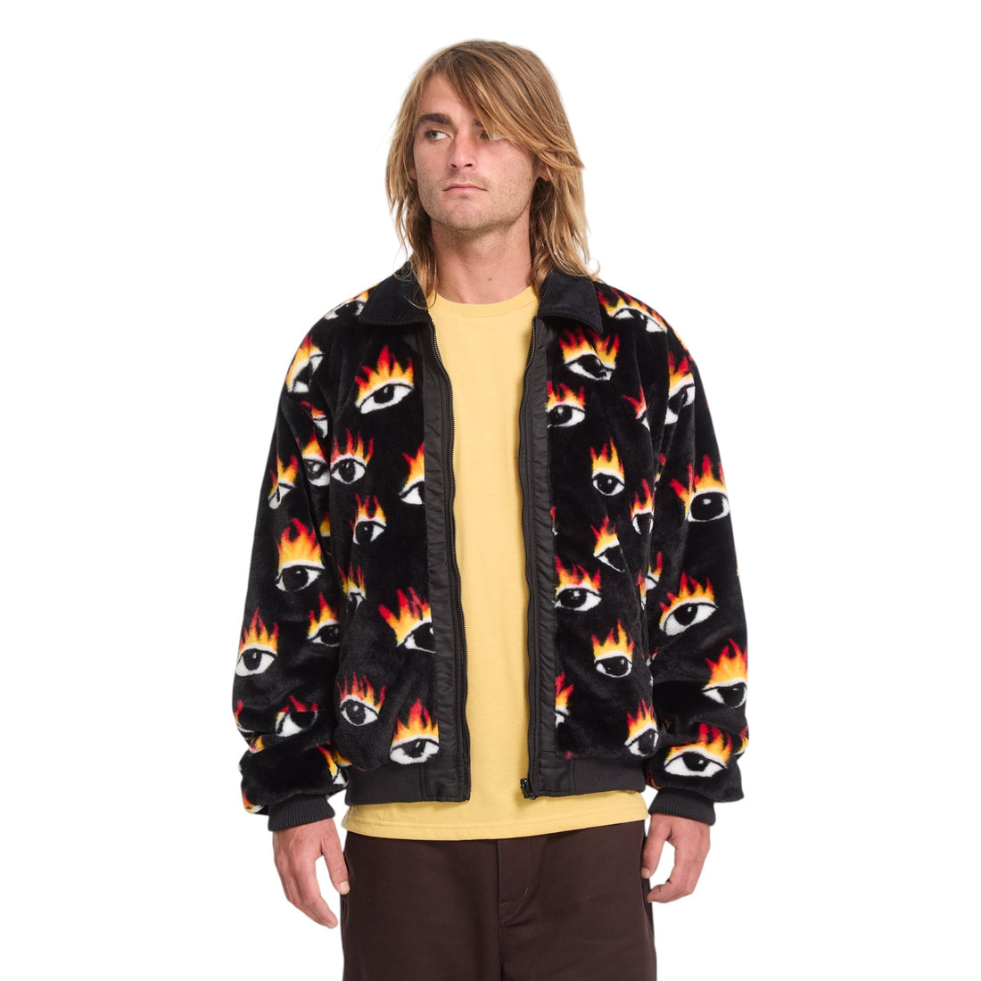 Homme portant la veste réversible Born2ride Volcom Fa Ozzy noire avec imprimé yeux et flammes et col en velours